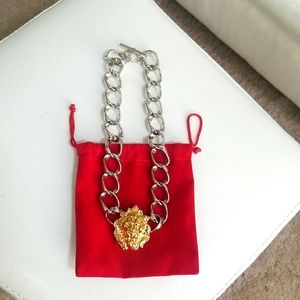 Silver link necklace with gold lion head